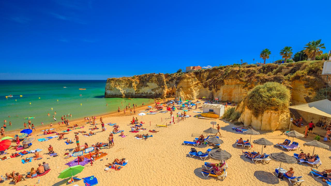 Beachgoers at the popular Dona Ana Beach in Lagos, Portugal. Picture: iStock