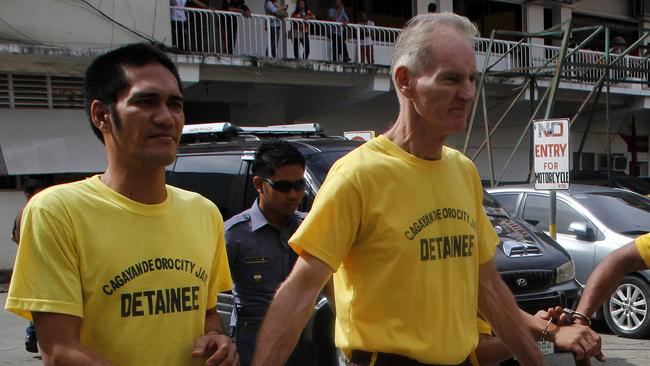 Peter Scully of Australia leaves the court handcuffed to other inmates Picture: AFP