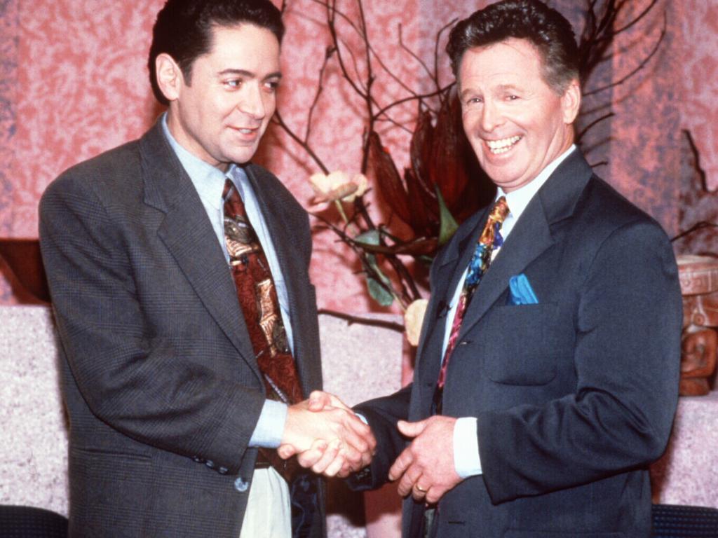 Quizmaster Tony Barber (R) and Brandon Burke (L) in TV show "Wedlocked" in September 1994.