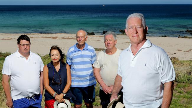 DEEPER WATER: Carrickalinga residents Chris Hughes, Rosemary Mather, Bill Chapman, John Lawrence and Chris Mather, front right, at Haycock Point. Inset, the Oceanlinx wave generator which sank off the coast in 2014 while being towed from Port Adelaide to Port MacDonnell.