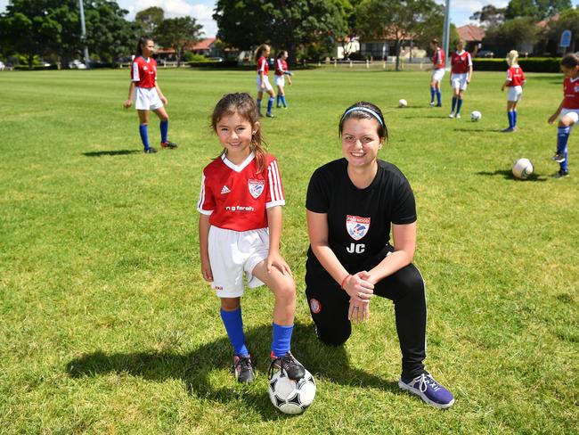 Pagewood Botany Football Club members Erin Jones and Coach Julia Chernoukha pose for a photo at Jellicoe Park in Pagewood, Sydney, Saturday, Nov. 11, 2017. (AAP Image/Joel Carrett)