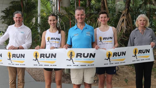 TTNQ chief executive officer Mark Olsen, Clare Robertson, Port Douglas Gran Fondo Managing Director Bade Stapleton, Luke Swindale and Douglas Shire Mayor Lisa Scomazzon get excited for the new Run Port Douglas event to make its Port Douglas Gran Fondo debut in September 2025. Photo: Catherine Duffy