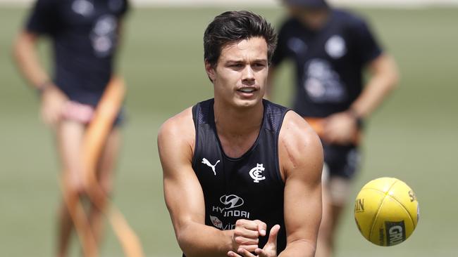 Jack Silvagni handballs during a training session.