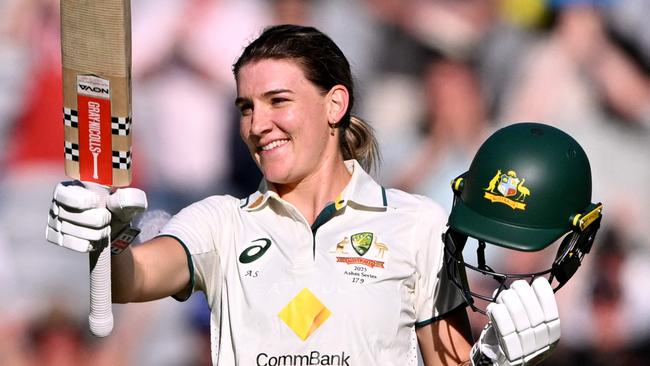 Australia's Annabel Sutherland celebrates scoring her century during the second day of the Women's Ashes cricket Test match between Australia and England at the Melbourne Cricket Ground (MCG) in Melbourne on January 31, 2025. (Photo by William WEST / AFP) / --IMAGE RESTRICTED TO EDITORIAL USE - STRICTLY NO COMMERCIAL USE--