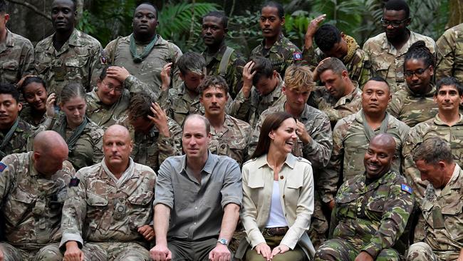 The couple with military personnel during a visit to the British Army Training Support Unit (BATSUB) jungle training facility in Chiquibul, Belize. Picture: Toby Melville/Pool/Getty Images