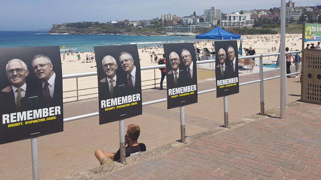 Signs at Bondi Beach remind voters of the Liberals’ own instability.