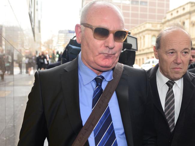 Raffaele Di Paolo (dressed in the blue shirt with sunglasses) leaving the Melbourne Magistrates' Court. Picture: Eugene Hyland