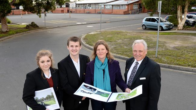 Croydon's Melba College senior campus is undergoing a rebuild thanks to a government grant. Year 9 students Jessica Scott and Nathan Dugdale with school council president Philippa Rowlands and principal Terry Bennett reviewing the artists impressions and drawings of the proposed new school buildings. Picture: Steve Tanner