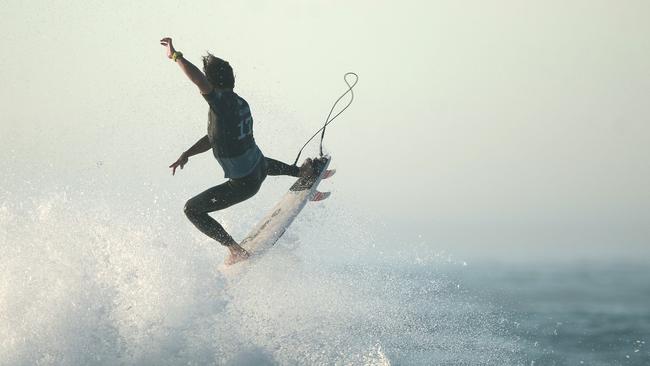 Australian surfer Julian Wilson flying high in France last year despite an injured shoulder. 