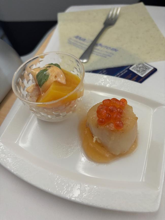 Pink grapefruit gelee and grilled scallop as an amuse-bouche.