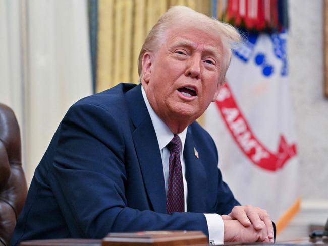 US President Donald Trump speaks to the media after signing executive orders in the Oval Office of the White House in Washington, DC, on January 23, 2025. (Photo by ROBERTO SCHMIDT / AFP)