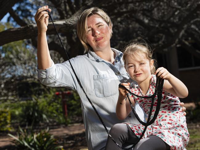 Keeley Henderson and daughter Poppy Henderson-Currey play with space slime Poppy made at iLAuNCH Space family fun day, part of UniSQ's Open Day, Sunday, August 18, 2024. Picture: Kevin Farmer