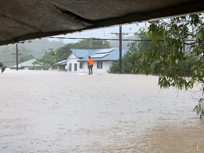 A paddleboarder rides down Cromer St in South Lismore on February 28, 2022.