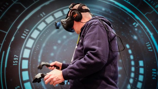 Chris Griffith tries out the HTC Vive at the CES tech show in Las Vegas.