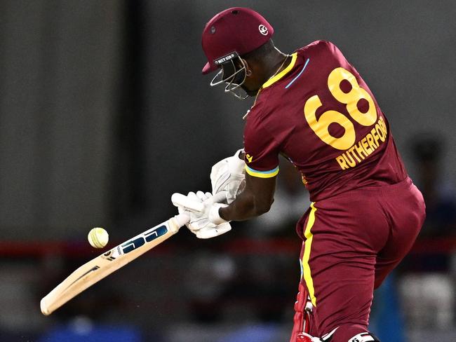 West Indies' Sherfane Rutherford hits a shot during the ICC men's Twenty20 World Cup 2024 Super Eight cricket match between England and the West Indies at Daren Sammy National Cricket Stadium in Gros Islet, Saint Lucia, on June 19, 2024. (Photo by Chandan Khanna / AFP)