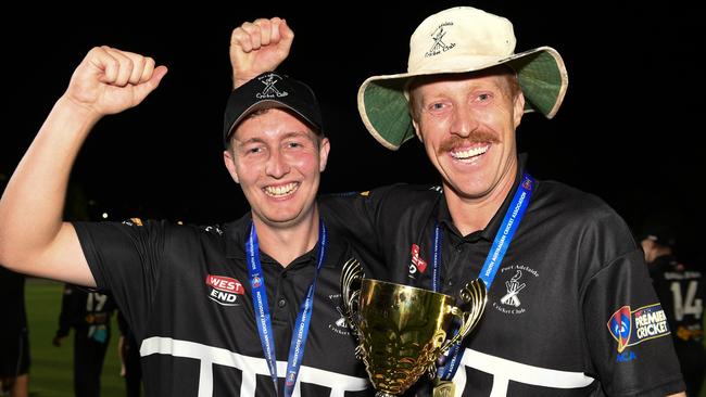 Port Adelaide captain Austin Umpherston and Nick Benton with the T20 trophy. Picture: Simon Stanbury