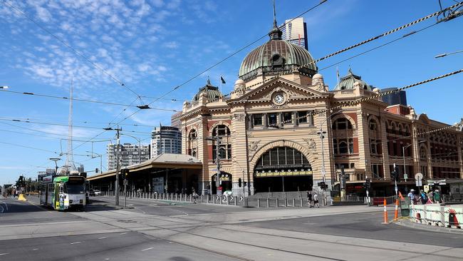 Flinders and Swanston Streets on the final day of the lockdown. Picture: NCA NewsWire / Ian Currie