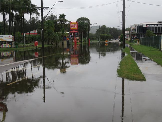 Gavenlock Rd, Tuggerah remains closed at the Hungry Jacks and McDonald's end because of localised flooding. Picture: Richard Noone