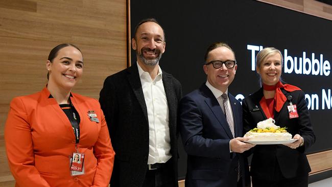 Jetstar CEO Gareth Evans (middle left) and Qantas CEO Alan Joyce (middle right) pose for a photograph at Sydney International Airport, Sydney. Picture: NCA NewsWire/Bianca De Marchi