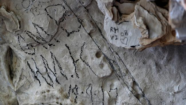 An area of aboriginal art damaged by graffiti at Beehive Falls in the Grampians. Picture: David Geraghty/The Australian.