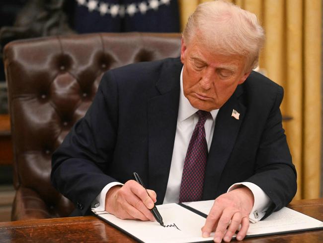 Trump used a Sharpie as he signed a record-breaking blitz of executive orders on his first day. Picture: AFP