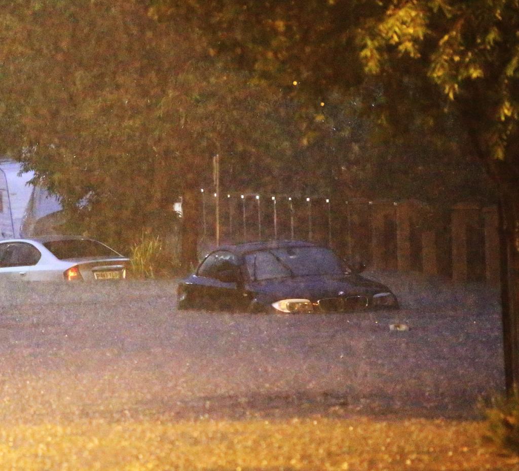 2 cars stuck on a flooded Macpherson Street In warriewood during heavy storms, Sydney, 14th March, 2019. Picture: Damian Shaw