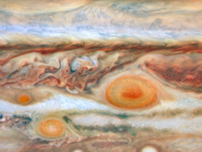 One possible explanation for the spot’s red colour is that the storm is so powerful it dredges material from beneath Jupiter’s cloud tops and lifts it to higher altitudes. Picture: AP