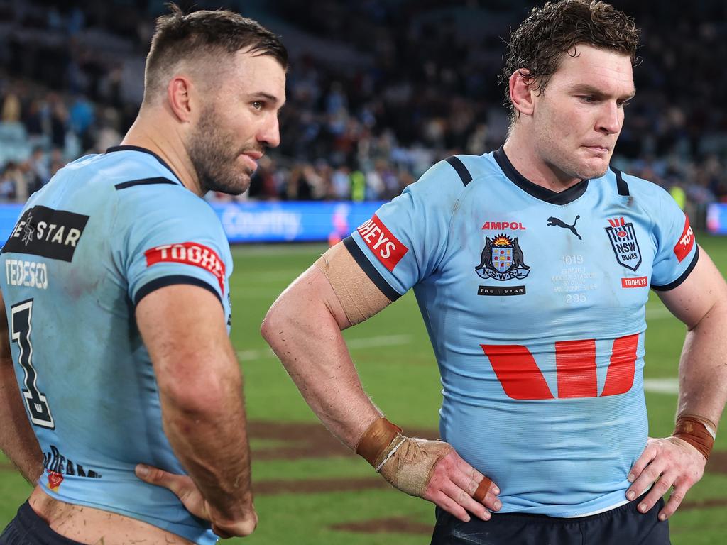 SYDNEY, AUSTRALIA - JUNE 05: James Tedesco and Liam Martin of the Blues react after losing game one of the 2024 Men's State of Origin Series between New South Wales Blues and Queensland Maroons at Accor Stadium on June 05, 2024 in Sydney, Australia. (Photo by Cameron Spencer/Getty Images)