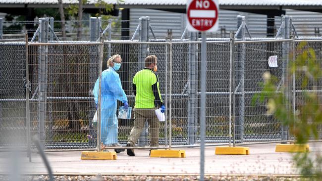 Workers at the former Howard Springs quarantine facility. Picture: Che Chorley