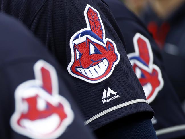 FILE - In this June 19, 2017 file photo, members of the Cleveland Indians wear uniforms featuring mascot Chief Wahoo as they stand on the field for the national anthem before a baseball game against the Baltimore Orioles in Baltimore. The Cleveland Indians are taking the divisive Chief Wahoo logo off their jerseys and caps, starting in 2019.  (AP Photo/Patrick Semansky, File)