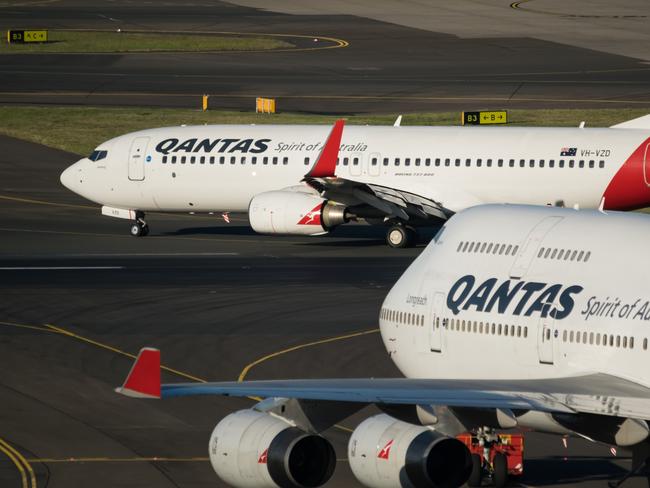 Two Boeing Commercial Aircraft at Sydney Kingsford Smith airport,  getting ready for take off