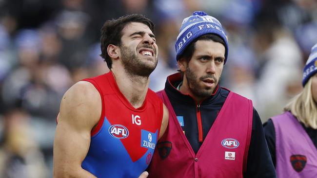 MELBOURNE, AUSTRALIAÃ June 10, 2024.  AFL Round 13. Big Freeze at the G. Collingwood vs Melbourne  at the MCG.   Christian Petracca of the Demons in pain after copping a Darcy Moore knee in the ribs late in the 1st qtr.       . Pic: Michael Klein