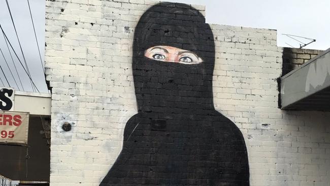 Lushsux Hillary Clinton mural in West Footscray has become a burqa wearing woman.