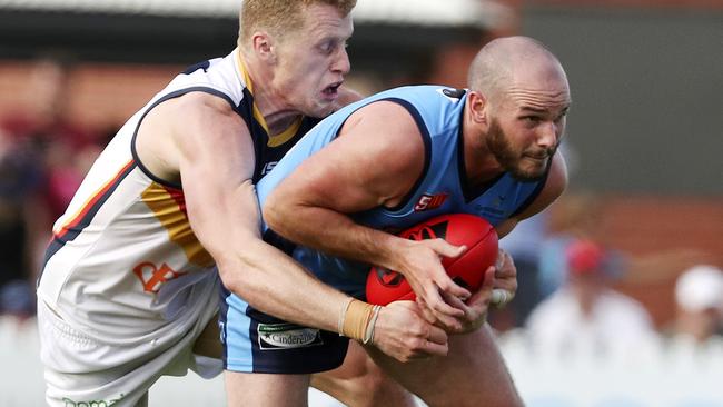 Sturt star Zane Kirkwood is tackled by Adelaide’s Reilly O'Brien. Picture Sarah Reed