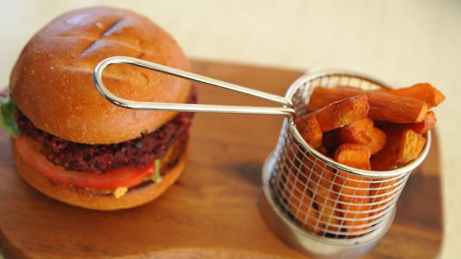 Veggie burger made with a beetroot and bean patty, cheddar, plus avocado and salad on a brioche bun served with sweet potato wedges. Picture: Stacey Roberts