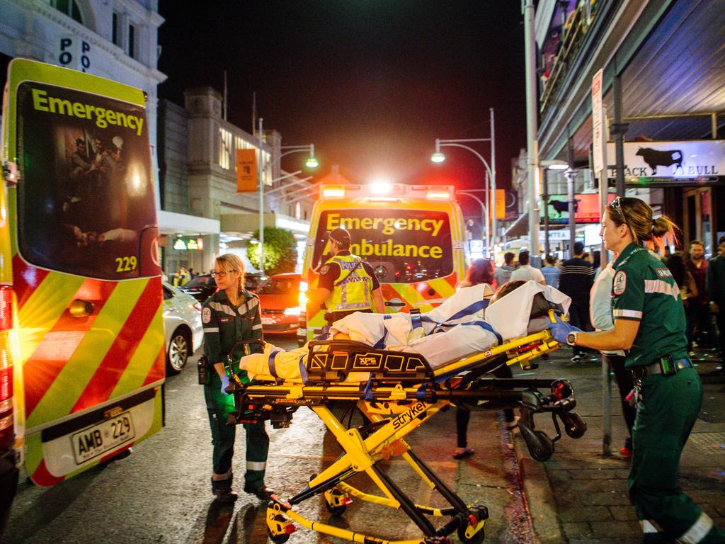 Paramedics attend to people needing help in Hindley St just after midnight, New Year’s Day, 2020. Picture: AAP / Morgan Sette