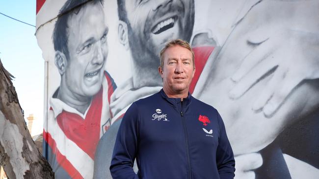 Roosters coach Trent Robinson at the club legends mural at Bondi Junction, which now includes a portrait of retired co-captain Jake Friend. Picture: Richard Dobson