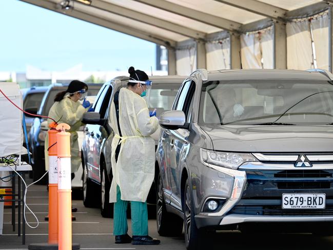 ADELAIDE, AUSTRALIA - NewsWire Photos MAY 26, 2021:  Cars queueing up at the Port Adelaide testing drive through clinic on Mundy Street in Port Adelaide after revelations that a person infected with Covid-19 attended the Collingwood V Port Adelaide game at the MCG last weekend. Picture: Naomi Jellicoe