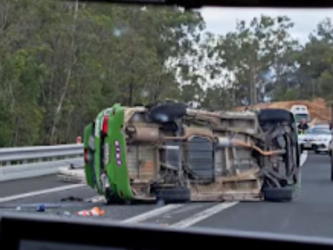 A Juicy campervan has rolled on its side following a two vehicle crash, closing the Bruce Highway.