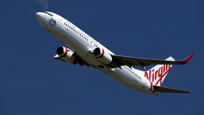 Only way is up ... a Virgin 737 takes-off from Cairns Airport. Picture: Marc McCormack/News Corp Australia