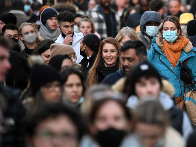 Shoppers walk along Oxford Street in central London. Picture: Daniel Leal/AFP