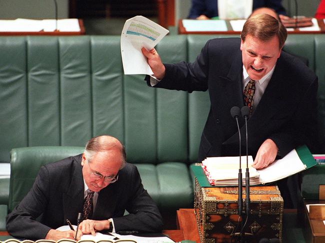 Federal Treasurer Peter Costello answers question during heated session, Question Time in House of Representatives, /PM John Howard (L) 03/12/96                        P/