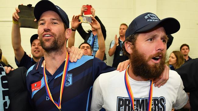 Sturt coach Martin Mattner and Scott McMahon celebrate after defeating Port Adelaide in the SANFL grand final.