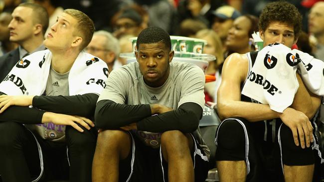 Brooklyn’s Mason Plumlee, Joe Johnson, and Brook Lopez of the Brooklyn Nets look dejected on the bench.