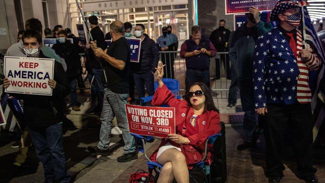 Donald Trump supporters hold signs and chant slogans during a protest outside the Philadelphia Convention center as votes continued to be counted following the 2020 US presidential election. Picture: Chris McGrath/Getty Images/AFP