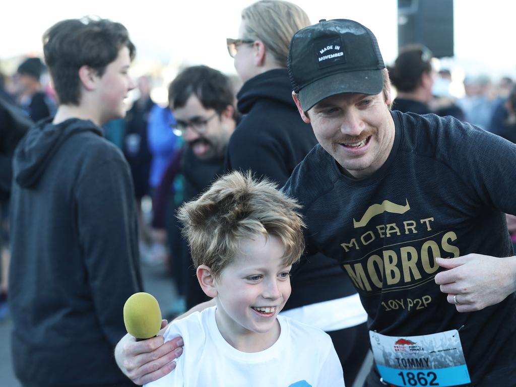 Hobart Mo Bros Tommy Windsor leads the warm up before the walk in the 2019 Point to Pinnacle. Picture: LUKE BOWDEN