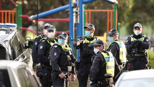 Police swarmed the towers during the hard lockdown. Picture: David Crosling