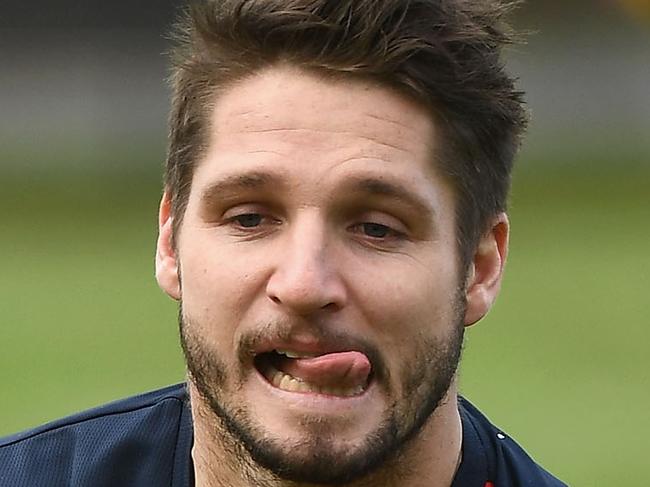 MELBOURNE, AUSTRALIA - JUNE 26:  Jesse Hogan of the Demons handballs during a Melbourne Demons AFL training session at Gosch's Paddock on June 26, 2017 in Melbourne, Australia.  (Photo by Quinn Rooney/Getty Images)