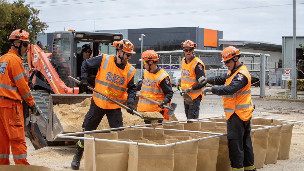 SES Netley workers demonstrate the speed and ease of filling a DefenCell with sand which can be used as a levee during flooding. Picture Emma Brasier