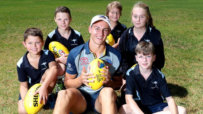 KING OF THE KIDS: Adelaide’s Tom Doedee was the toast of Kangarilla Primary School yesterday as the Crows hit the road for their AFL Community Camp. Picture:  Dylan Coker